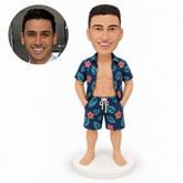 custom bobblehead figure man in an open hawaiian shirt and matching beach shorts with both hands in pockets