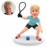 custom bobblehead figure female racquetball player crouching with a raised racket and a gloved hand