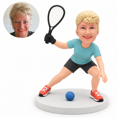 custom bobblehead figure female racquetball player crouching with a raised racket and a gloved hand