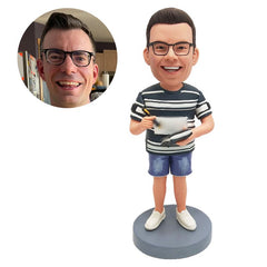 custom made bobble head figure male coach holding a notebook and a pen