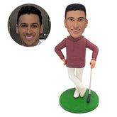 custom bobblehead figure golfer holding a golf club with one hand on the hip