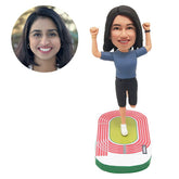personalized bobble head figure female runner with hands up on the playground