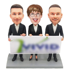 custom made bobbleheads figures three colleagues holding a board of company Logo