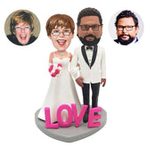 personalised bobble heads figures wedding couple arm in arm with LOVE on the base