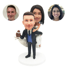 custom made bobble heads figures wedding couple carrying the bride with a football