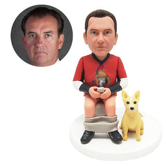 customised bobblehead figure funny man sits on the toilet with a pet