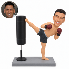 custom bobblehead figure male kickboxer making a high side kick against a freestanding training bag