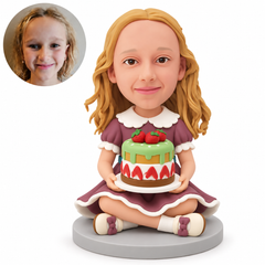 custom bobblehead figure girl sitting cross-legged while holding a strawberry cake on a plate