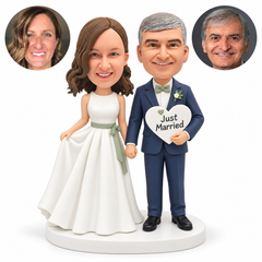 custom bobblehead figures wedding couple holding hands with the bride lifting her skirt and the groom holding a heart-shaped Just Married sign