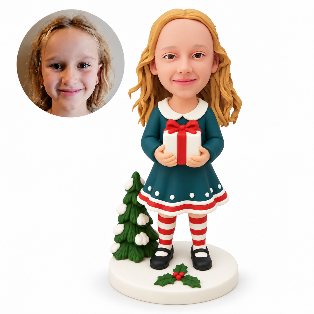 custom bobblehead figure girl in a festive dress holding a wrapped gift with both hands beside a small Christmas tree