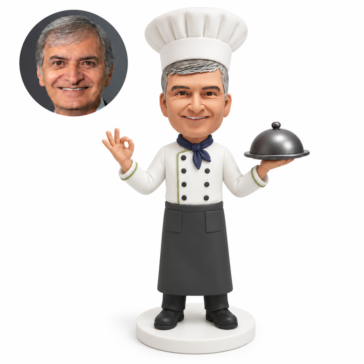 custom bobblehead figure male chef holding a covered serving dish in his left hand and making an OK gesture with his right hand