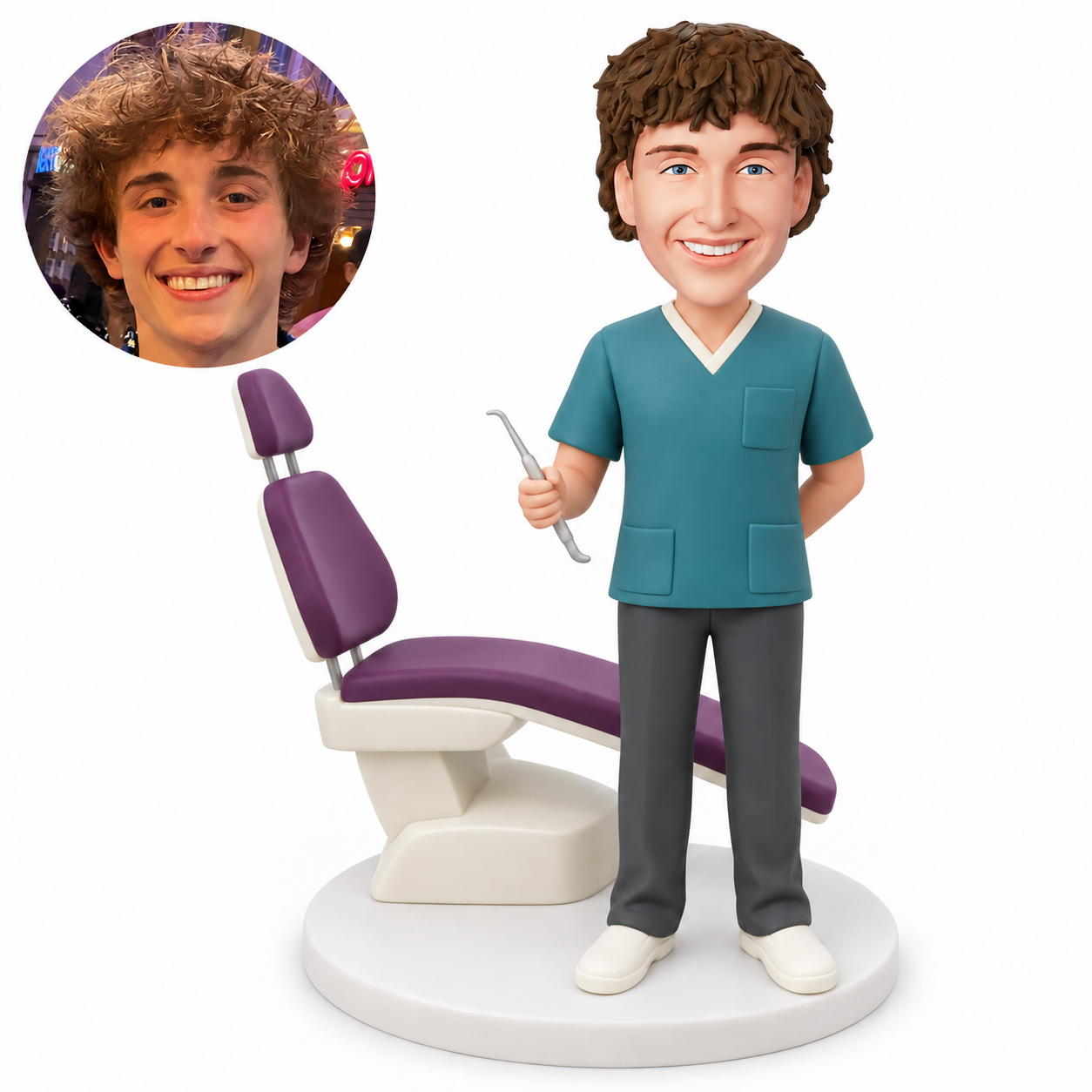 custom bobblehead figure male dentist in scrubs holding a dental tool with one hand behind his back beside a dental chair