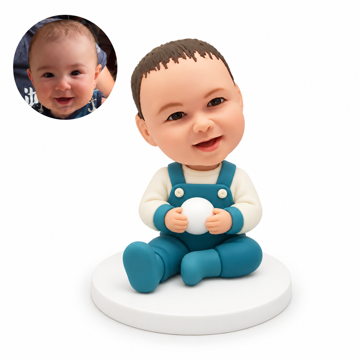 custom bobblehead figure baby seated on the floor holding a small round ball with both hands