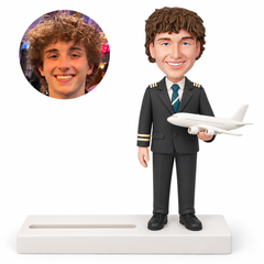 custom bobblehead figure male pilot holding a model airplane on a business card holder base