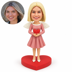 custom bobblehead figure woman with fixed feathered angel wings cupping a small red heart at her waist on a heart-shaped base