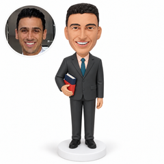 custom bobblehead figure male teacher cradling two closed books in his right arm with his left hand lowered