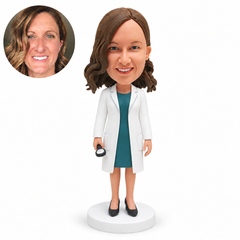 custom bobblehead figure female doctor with both arms lowered holding a small handheld medical device