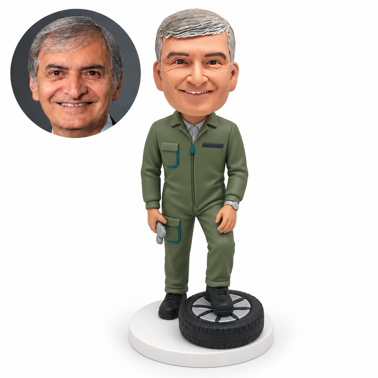 custom bobblehead figure male mechanic standing with one foot on a flat car wheel and a small tool in his lowered hand