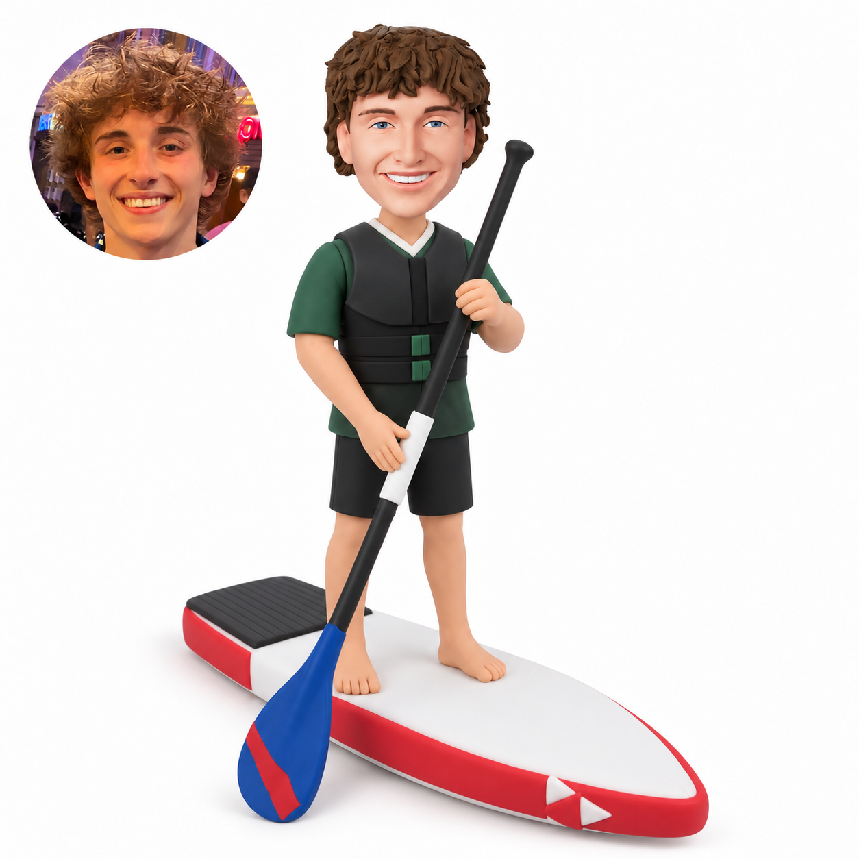 custom bobblehead figure male paddleboarder standing barefoot on a paddle board while holding one long paddle with both hands