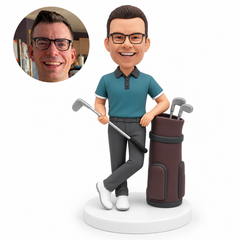 custom bobblehead figure male golfer with crossed ankles holding an iron diagonally across his waist in his right hand and resting his left arm beside a golf bag