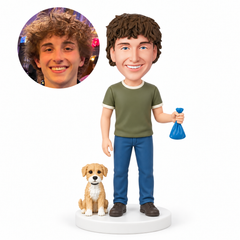 custom bobblehead figure man holding a tied cleanup bag beside a small dog