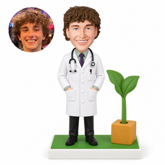 custom bobblehead figure male doctor with both hands in his coat pockets beside a sculpted potted plant