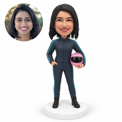 custom bobblehead figure female racer holding a full-face helmet at her left hip with her right hand in her pocket