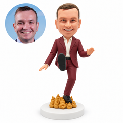 custom bobblehead figure man lifting one shoe forward while standing on sculpted poop ornaments