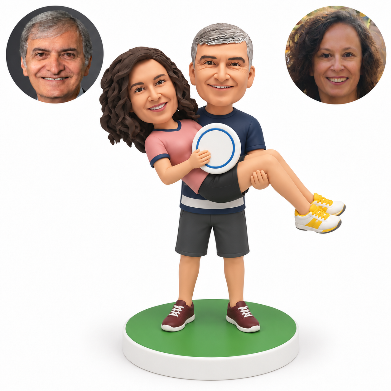 custom bobblehead figures man carrying a woman across his arms while she holds a round disc
