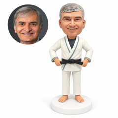 custom bobblehead figure taekwondo man holding both ends of his black belt