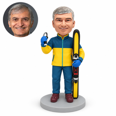Custom male skier bobblehead holding one upright ski and raising a small loop handle