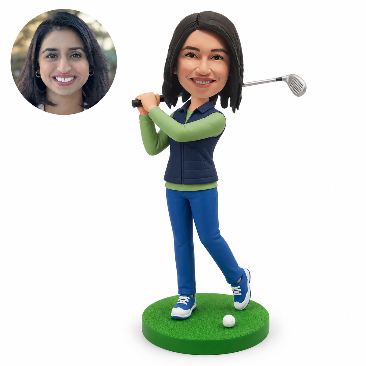 Custom female golfer bobblehead finishing a golf swing with both hands on a club over the shoulder and a golf ball on the base