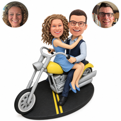custom bobblehead figures couple embracing face to face on a yellow cruiser motorcycle