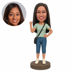 Custom woman bobblehead raising a fist with a crossbody bag
