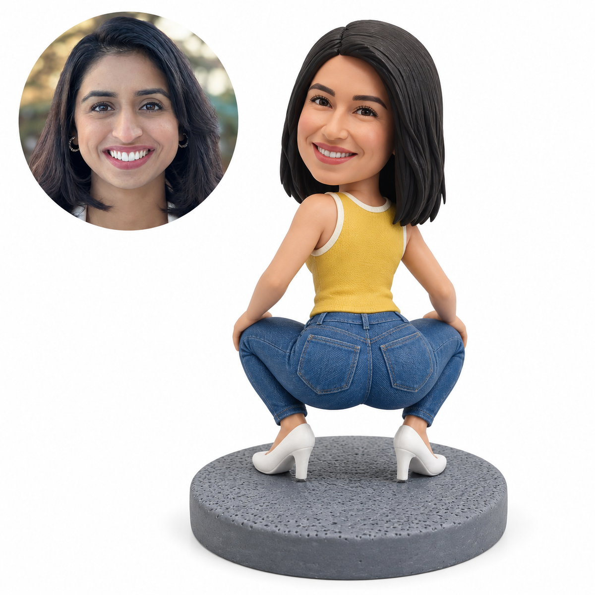 Custom soft-clay bobblehead woman in a deep rear-facing squat, wearing a muted yellow sleeveless top, blue jeans and white heels on a gray round base, with matching real-photo portrait.
