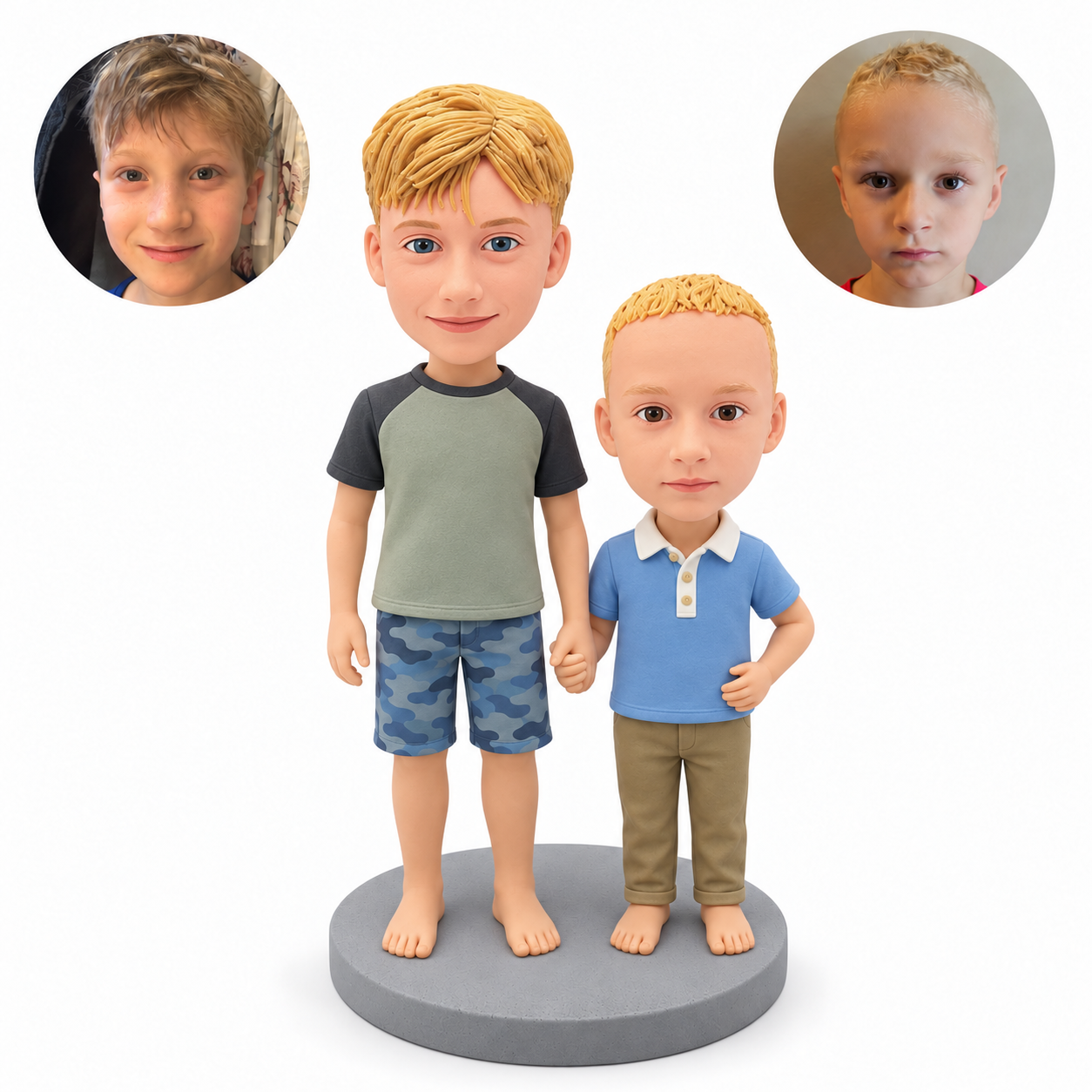 Custom clay bobblehead figures of two barefoot brothers holding hands, older boy in a sage raglan shirt, younger boy in a blue polo, with matching real portrait photos