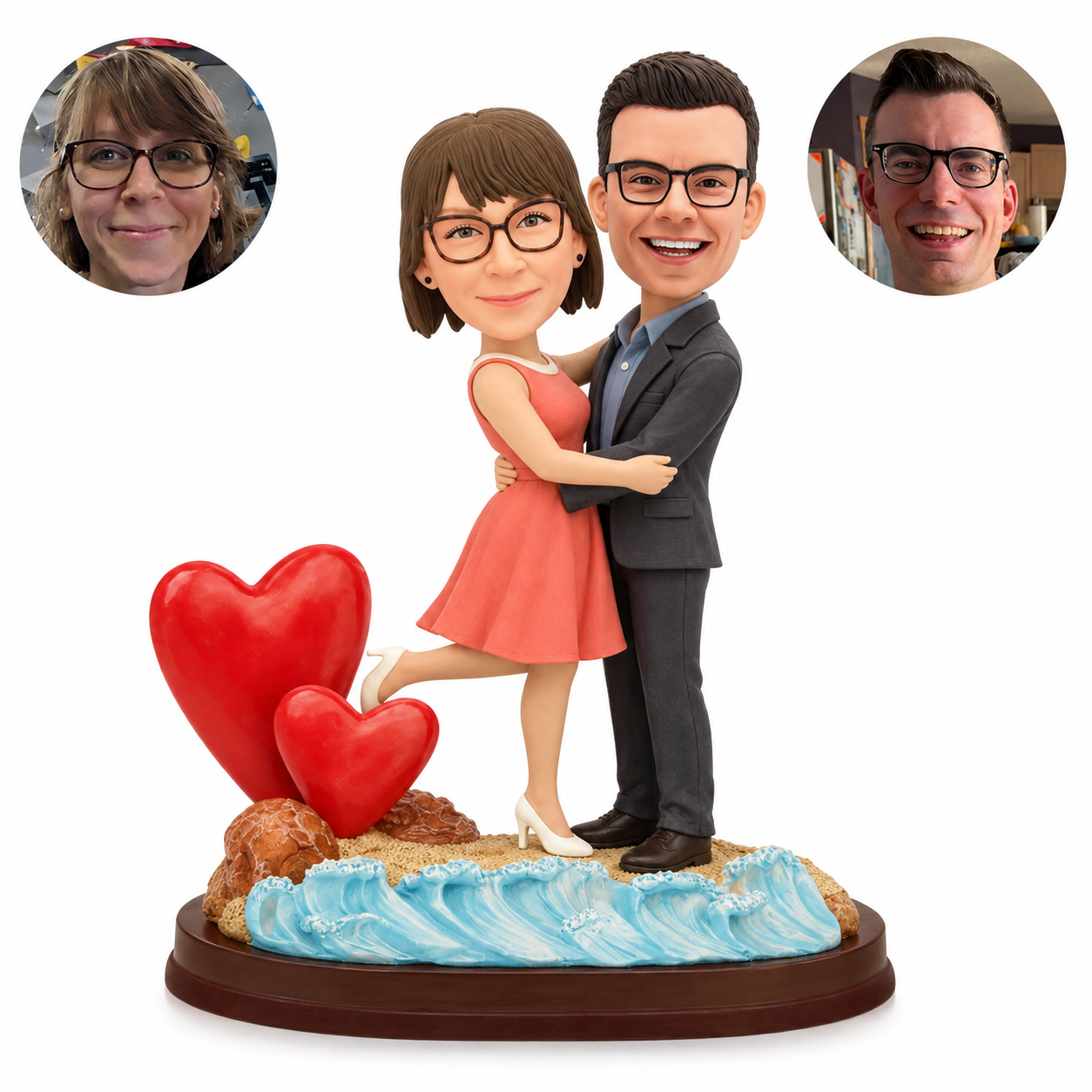 Custom clay couple embracing by two red hearts and sculpted ocean waves, with woman lifting one leg and matching real photo portraits.