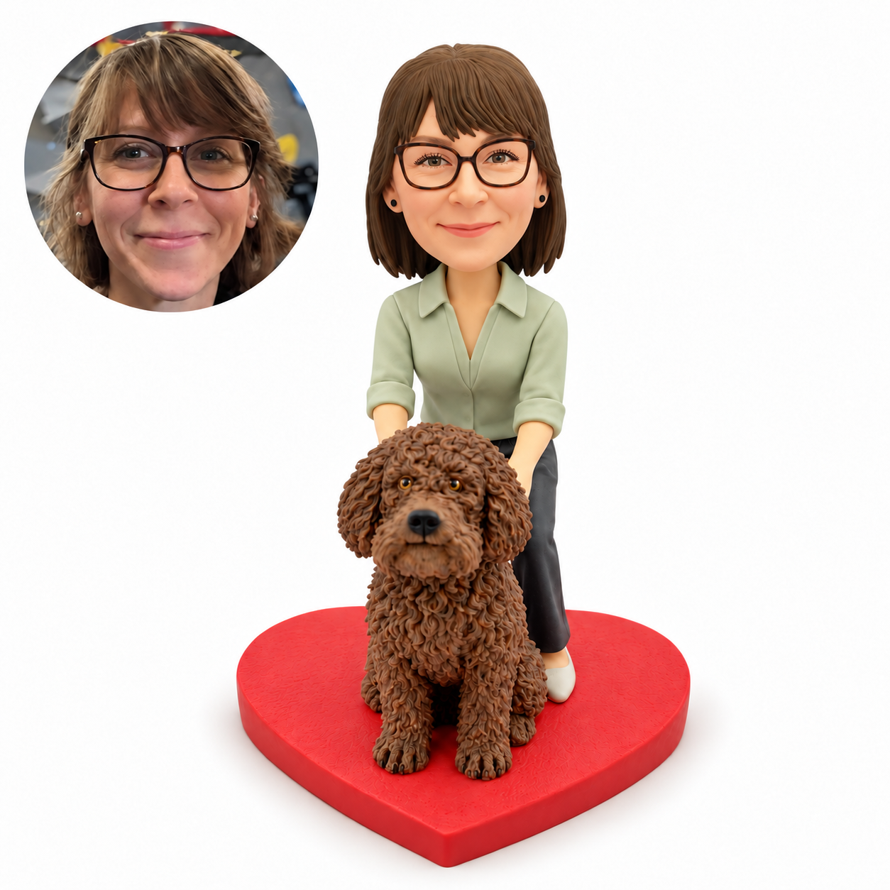 Custom bobblehead figure of a woman in a sage blouse resting both hands on a large seated curly brown dog, on a red heart base, with matching portrait inset.