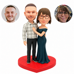 custom bobblehead figures couple with a woman's hand on his chest and a waist embrace