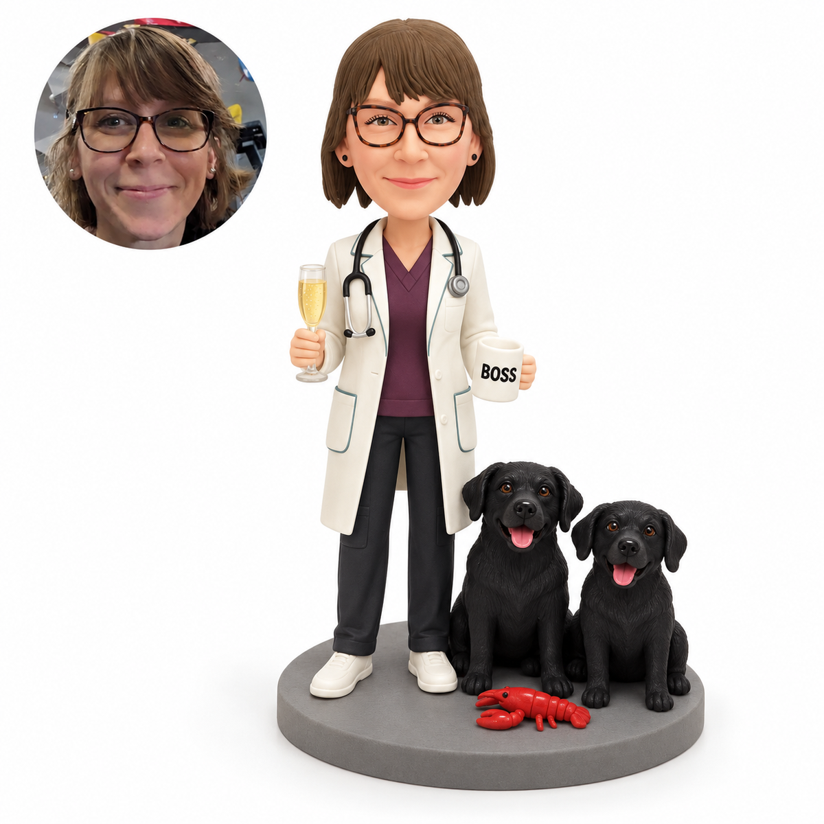 Custom clay female doctor holding a champagne flute and mug beside two fixed black dogs on a gray base, with matching real portrait