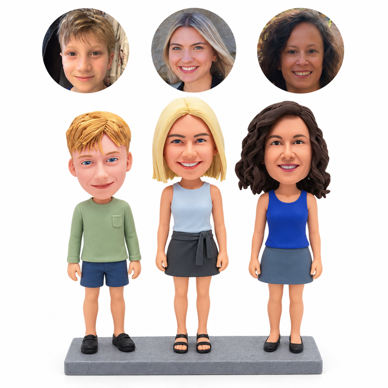 Three-person custom polymer-clay bobblehead with a boy at left and two adult women standing beside him, three matching real portrait circles and a shared gray base
