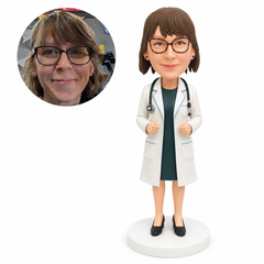 Female doctor bobblehead with both hands raised at her waist