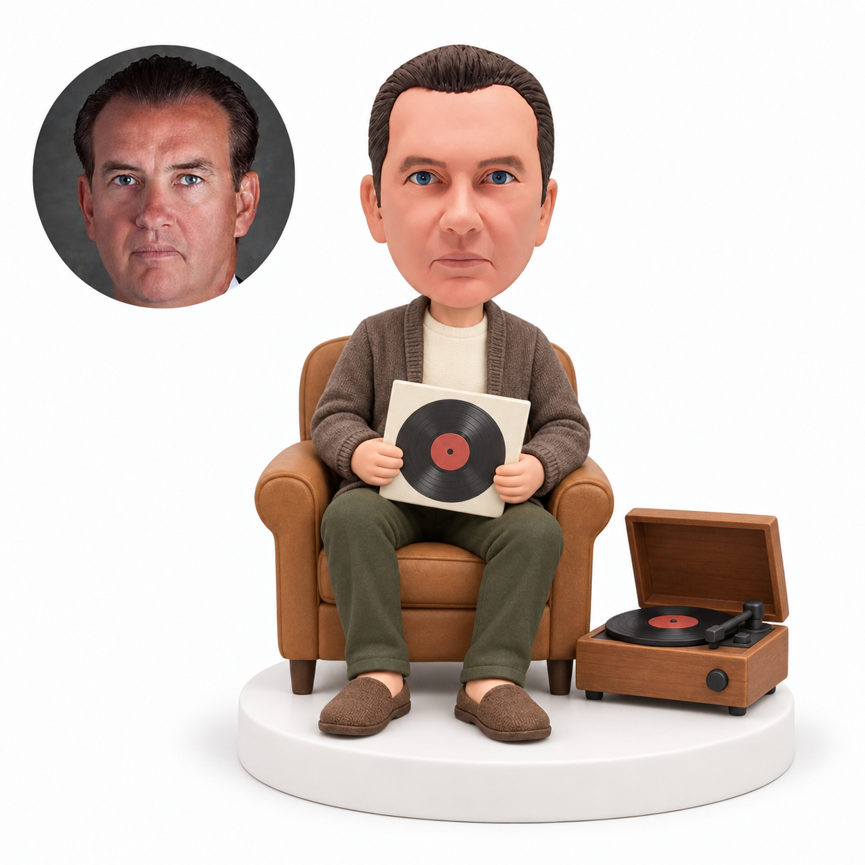 custom bobblehead figure man seated beside a vinyl record player
