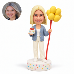 custom bobblehead figure woman holding a birthday cake and balloons