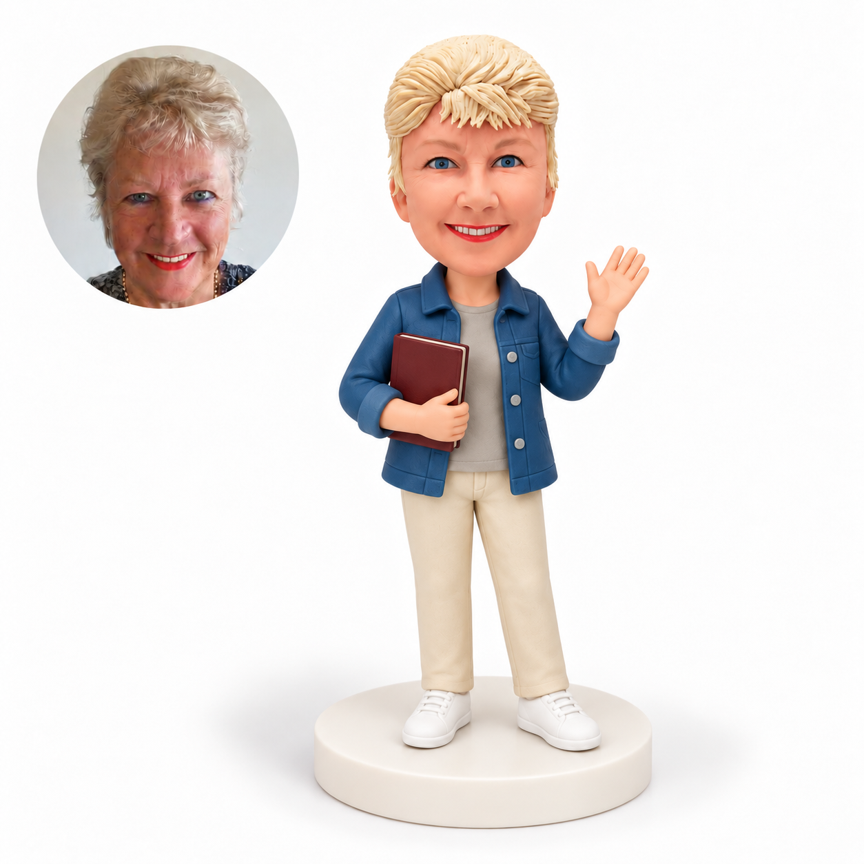custom bobblehead figure woman waving while holding a book