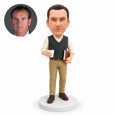 custom bobblehead figure man in a sweater vest holding coffee and a notebook