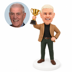 custom bobblehead figure man raising a trophy with a hand on hip