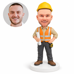 custom bobblehead figure construction worker holding a rolled blueprint