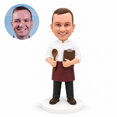 custom bobblehead figure chef holding a spoon and clipboard