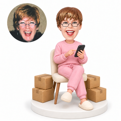 custom bobblehead figure woman checking her phone beside packages